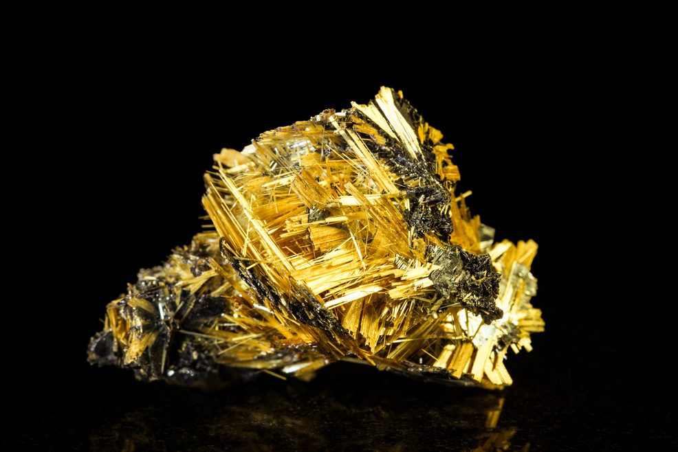 hematite with rutile in front of black
