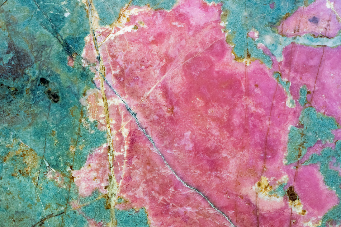 Rhodonite pink massive. Close-up of manganese inosilicate marble like surface